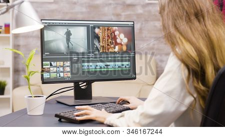Creative Female Filmmaker Working On Post Production Of A Movie