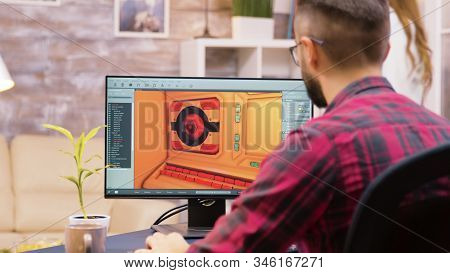 Close Up Shot Of Game Developer Working On A New Level Of Game