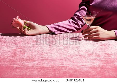 Cropped View Of Woman Holding Rose And Glass Of Rose Wine On Velour Cloth Isolated On Pink, Girlish 