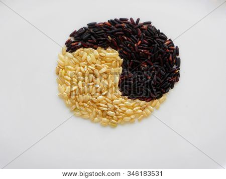 Black And Brown Rice On A White Background