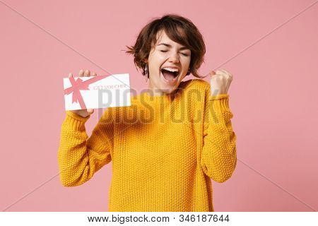 Joyful Young Brunette Woman Girl In Yellow Sweater Posing Isolated On Pastel Pink Background Studio 