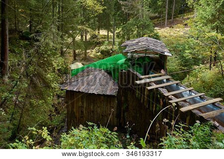 Screw Lifting Device For Pumping Water From A River Or Stream. Water Pumping System, Old Engineering
