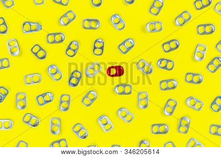 Ring - Pull Cap Of Can On A Yellow Background, Aluminum Cap Can Be Used To Make Prostheses Legs.