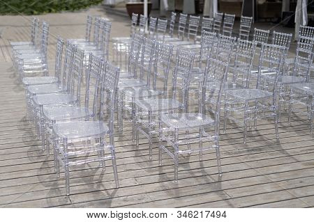 Chiavari Chairs Are Transparent, At A Beautiful Wedding Event.