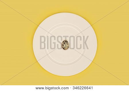 One 1 Lonely Boiled Quail Egg On White Plate On Yellow Background. Minimal Minimalism. Dietary Nutri
