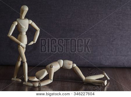 Femdom. Wooden Figures. The Woman Dominates The Man. Household Slavery. Inequality Of The Sexes.