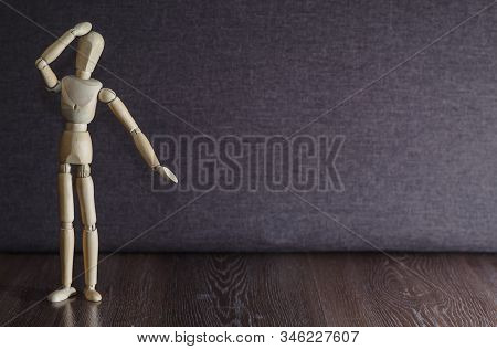 A Figurine Of A Wooden Man Remembers What Happened
