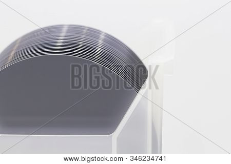Pieces Of Polycrystalline Silicon On A Polysilicon Wafer With Microchips.