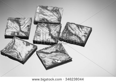 Pieces Of Polycrystalline Silicon On A Polysilicon Wafer With Microchips.