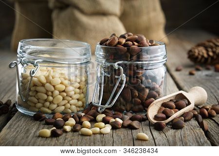 Pine Nuts. Jars And Bags Of Cedar Pine Nuts.