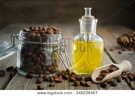 Pine Nuts And Pine Nuts Essential Oil Bottle.