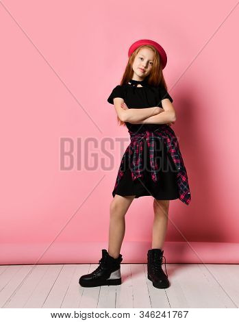 Ginger Teenage Kid In Black Dress, Checkered Shirt On Her Waist, Red Hat And Choker. She Smiling, Ha