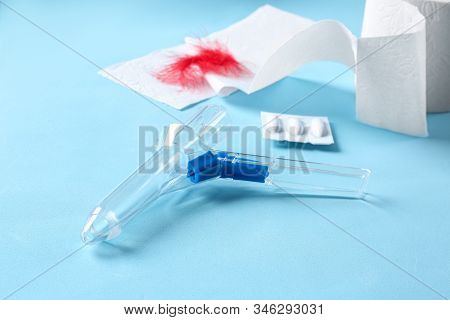Anoscope On Light Blue Background. Hemorrhoid Treatment