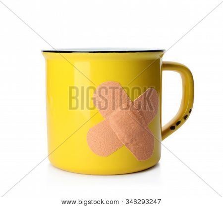 Mug With Sticking Plasters Isolated On White