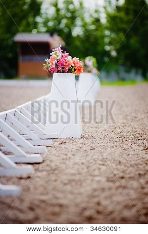 Blumen in einem Topf-Zaun