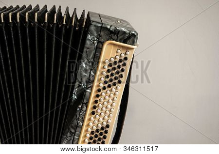 Fragment of classical retro bayan (accordion), musical instrument 