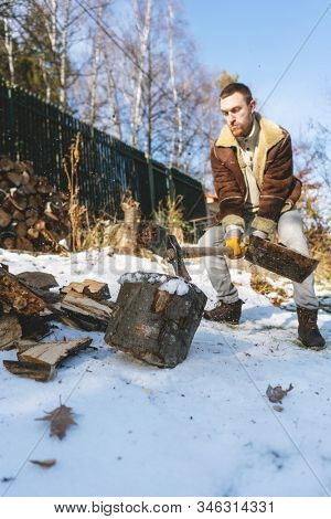 Man chopping wood with an axe, pieces and debris flying around, dynamic action scene