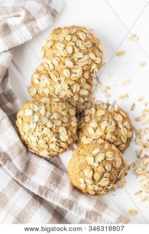 Cereal oatmeal cookies on white table.