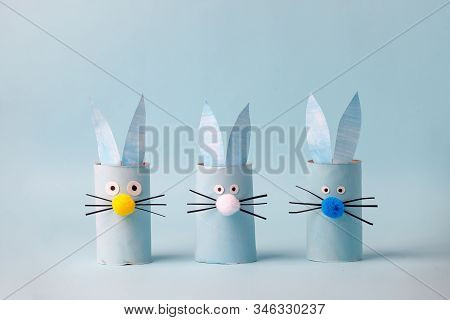 Set Of Paper Bunny Rabbit For Happy Easter Seasonal Party. Easy Craft For Kids On Blue Background, S
