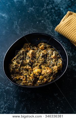 Indian Dish Spinach Lamb Palak With Chappati Flat Bread. Traditional Dish.