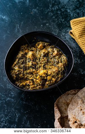 Indian Dish Spinach Lamb Palak With Chappati Flat Bread.
