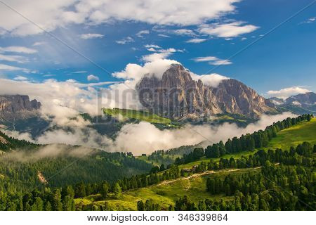 Magnificent View Of Sassolungo Massif And Gardena Valley Covered By White Clouds, Dolomites, Italy