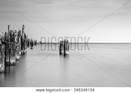 Wooden Breakwater On A Beach In Ustka, Poland, Baltic Sea