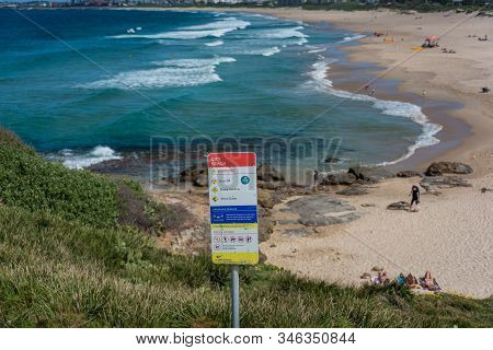 Wollongong, Australia - September 20, 2015: Warning Sign On Wollongong City Beach With Beach On The 