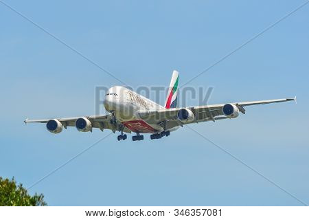 Passenger Airplane Landing At Changi Airport