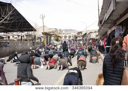 Jammu Kashmir, India - March 20 : Tibetans Walking Parade On The Road For Respect Praying Buddha Cha
