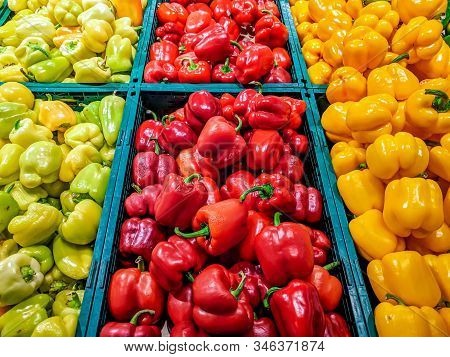 Colorful Bell Peppers In Green, Red And Yellow Colors Stacked In Market Grocery Store For Sale As A