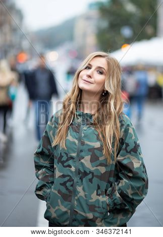 Young Women In Camouflage Jacket