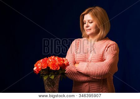The Woman With A Bouquet Of Flowers. A Gentle Photo With Roses..