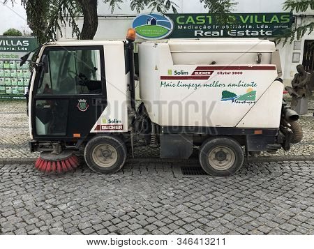 Albufeira, Portugal - December 26, 2019: White Bucher Citycat 2000 Sweeper Parked By The Side Of The