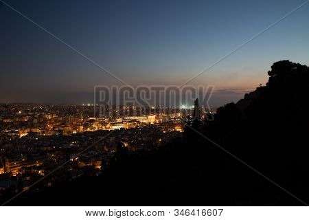 Night View Of The City From Filopappos Hill In The Evening, Athens, Greece.
