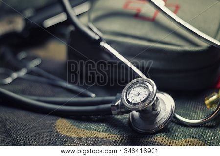 Stethoscope Lies On The Uniform Of A Us Soldier. The Concept Of Health Care, Military Insurance, Sta