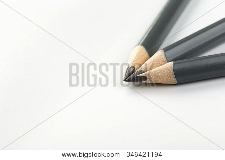 Three  Gray Triangular Pencil Isolated
On White Background