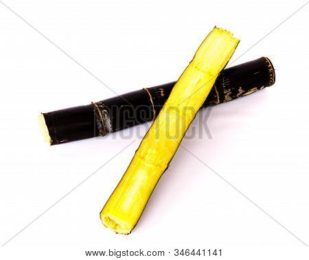 Studio Shot Organic Sugarcane Stalk With Half Cut Isolated On White