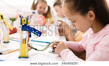 Stem Education. Smart Girl Programming Robot, Working With Wires And Circuits