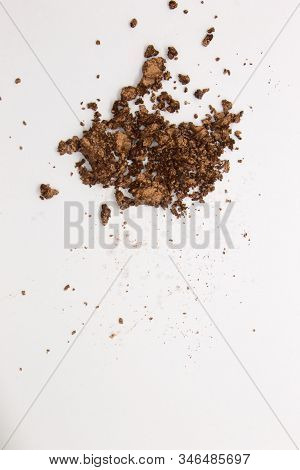 This Is A Photograph Of A Metallic Bronze Powder Eyeshadow Isolated On A White Background