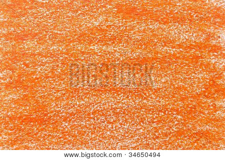Oranžová pastelka na bílém papíře