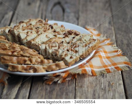 Traditional Apple Pie, Cupcake With Dried Apples, Closeup Presented On A Wooden Table. Home Cooking.