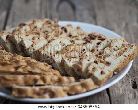 Traditional Apple Pie, Cupcake With Dried Apples, Closeup Presented On A Wooden Table. Home Cooking.