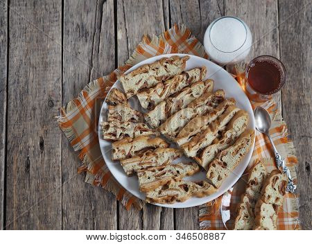 Traditional Apple Pie, Cupcake With Dried Apples, Closeup Presented On A Wooden Table. Home Cooking.