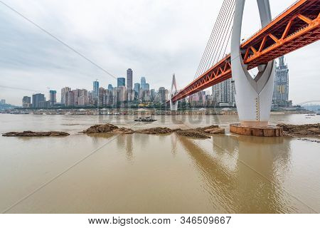 Chongqing, China - June 12, 2019 : Dongshuimen Bridge Above Yangtze River In Daylight With Yuzong Pe