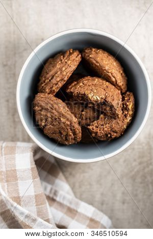 Cereal cocoa cookies in bowl. Top view.