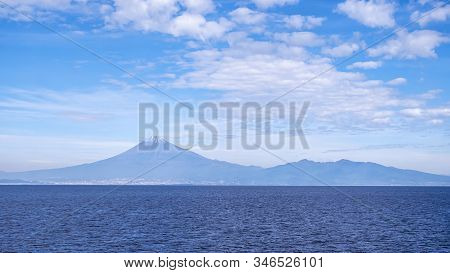 Fuji Mountain Landscape View Over Blue Sky And White Cloud From The Ferry Boat In The Ocean At Surug