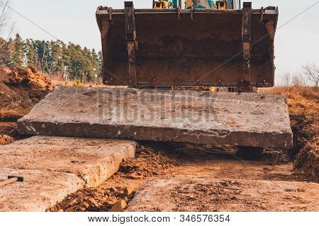 Road On Concrete Slabs To The Gate Of A Private House In The Village.
