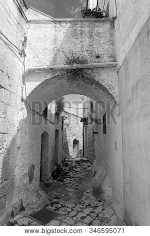 White Buildings Of Laterza, Taranto, Apulia, Southern Italy, Historic Town. Typical Alley. Black And