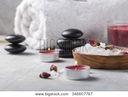 Spa Concept: Composition Of Spa Treatment With Spa Stone. Beauty Still Life Of Massage Oil Bottle Of
